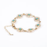 Arany tónusú Emporia Ötvözetű Szett Türkizzel és Fehér Emporia® Kristállyal ( Nyaklánc+Karkötő )